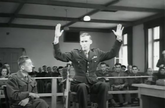 An American survivor of the Malmedy Massacre testifies in a war crimes trial in Dachau, Germany, May 20, 1946.