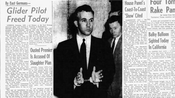 Newspaper photograph of a handcuffed Francis Yockey being led into court, June 1960